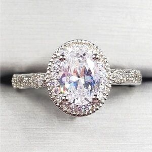 Oval Cut Diamond Simulant Silver Tone Engagement Milgrain Halo Ring